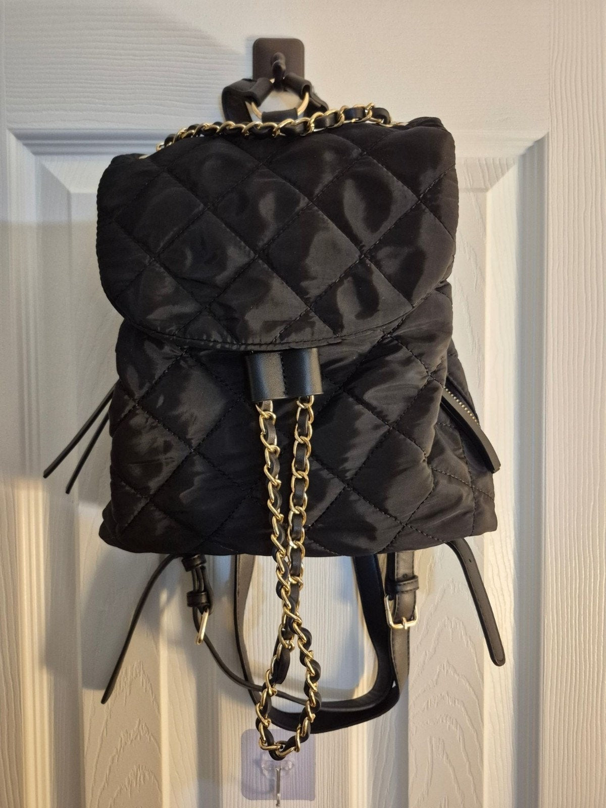 Quilted Black Backpack With Gold Chain Accents & Adjustable Straps